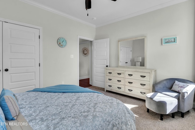 bedroom featuring carpet, ornamental molding, ceiling fan, and baseboards