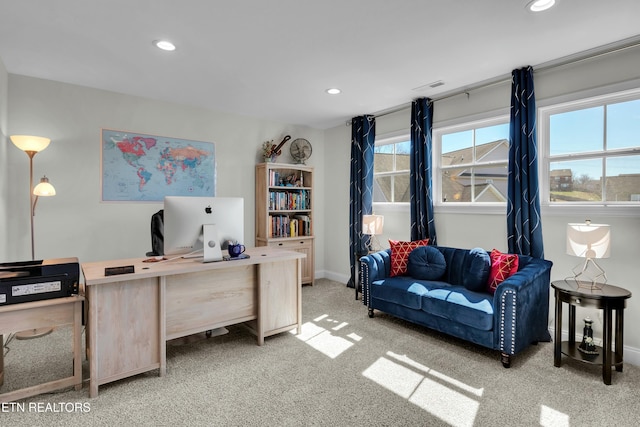 office space featuring light carpet, baseboards, visible vents, and recessed lighting