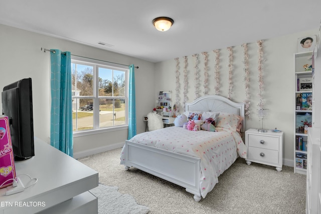 bedroom featuring light carpet, baseboards, and visible vents