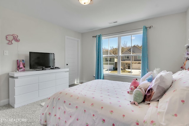 bedroom with carpet, visible vents, and baseboards