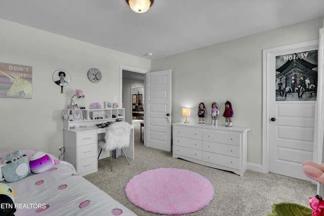 bedroom featuring light carpet