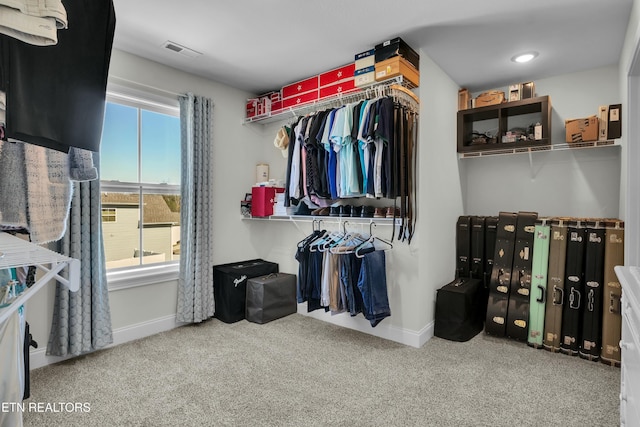 walk in closet featuring carpet floors and visible vents