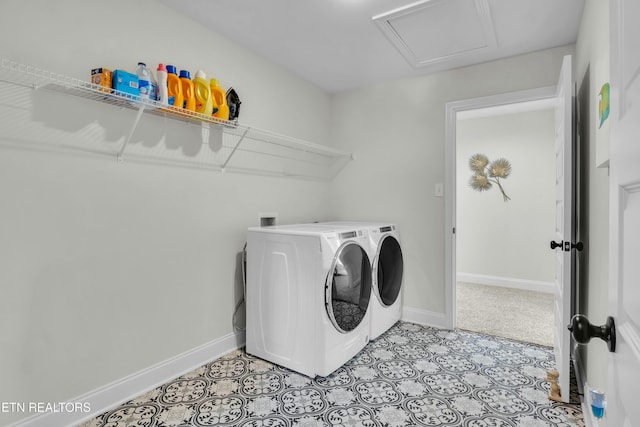 laundry area with laundry area, washing machine and dryer, attic access, and baseboards