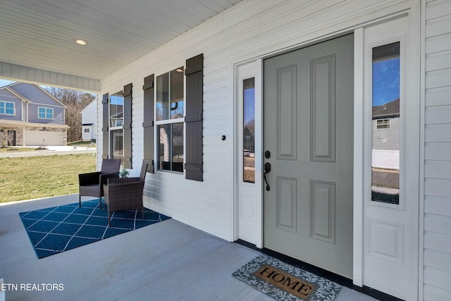 doorway to property with a porch