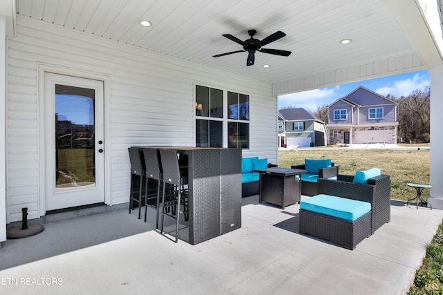 view of patio with an outdoor hangout area and a ceiling fan