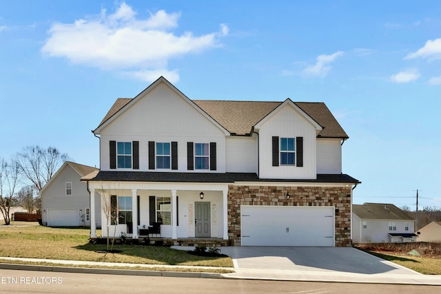 view of front of home featuring a shingled roof, concrete driveway, stone siding, an attached garage, and a porch