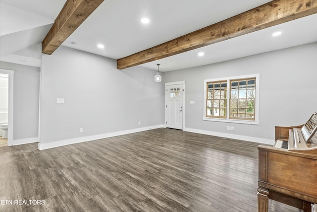 unfurnished living room with beamed ceiling, recessed lighting, baseboards, and dark wood-style flooring