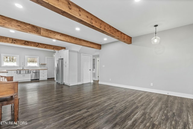 unfurnished living room with recessed lighting, baseboards, beam ceiling, and dark wood-style flooring