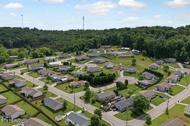 aerial view with a residential view and a view of trees