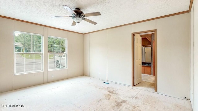 spare room with a textured ceiling, a ceiling fan, and crown molding