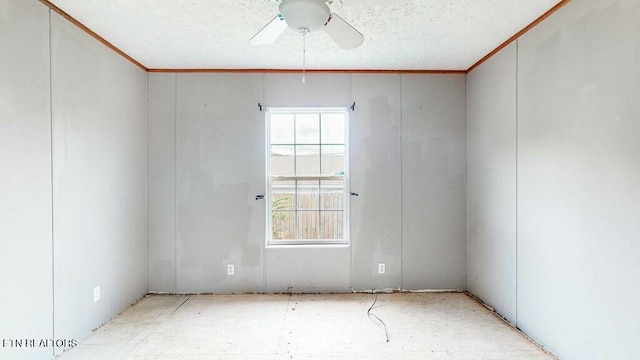 spare room featuring a ceiling fan, crown molding, and a textured ceiling