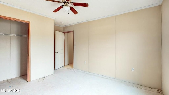 unfurnished bedroom with ornamental molding, a closet, and a ceiling fan