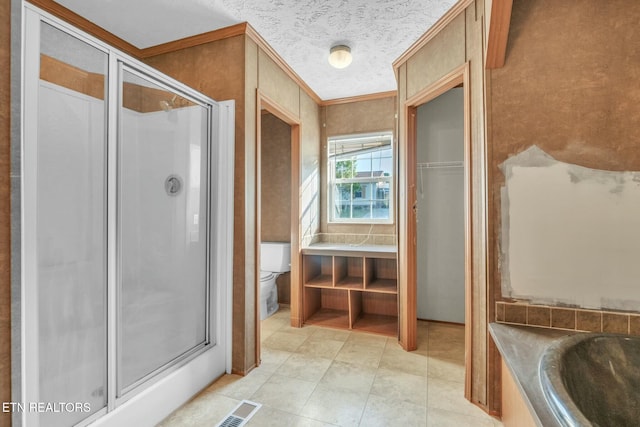 902 Oak Village Ct, Dandridge, TN 37725 - full bathroom featuring a shower stall, tile patterned floors, toilet, ornamental molding, and visible vents