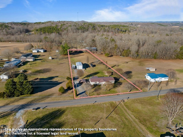 birds eye view of property with a rural view