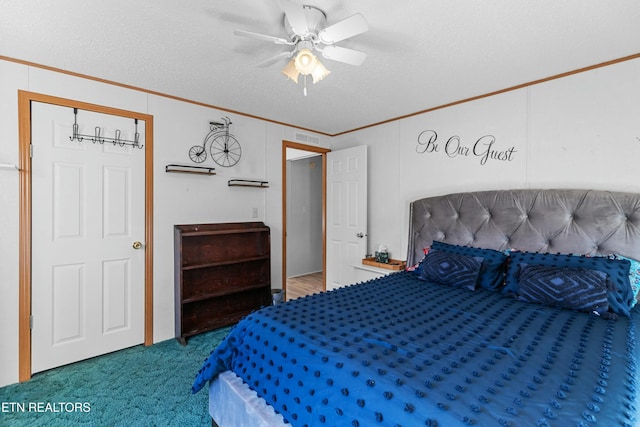 carpeted bedroom featuring ceiling fan, a textured ceiling, visible vents, and crown molding