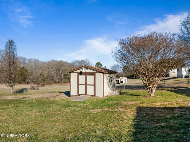 view of shed with fence