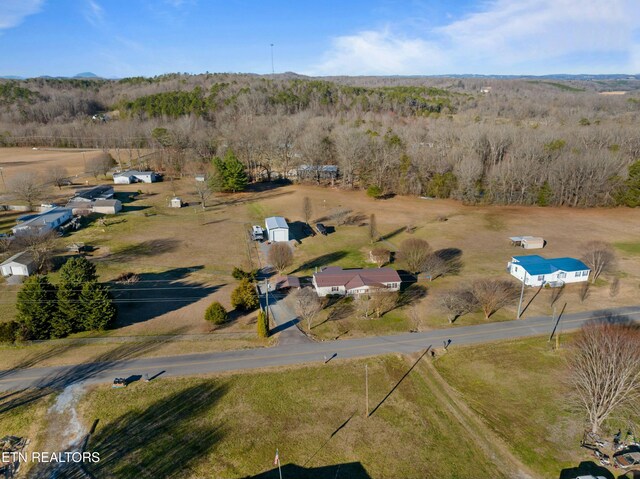 birds eye view of property featuring a rural view