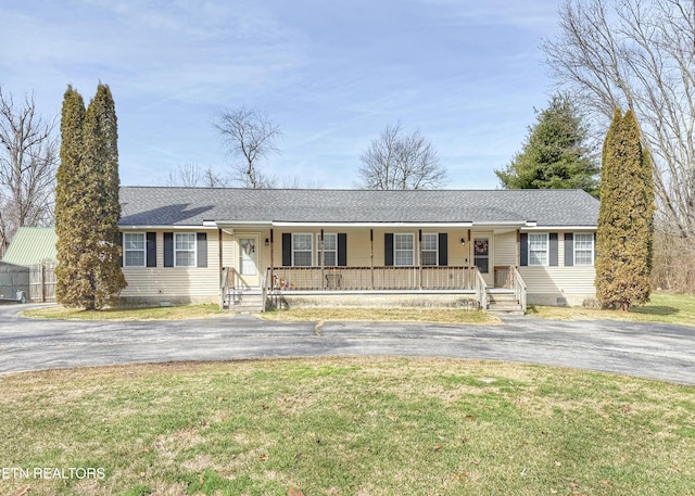 ranch-style house featuring aphalt driveway, a front yard, crawl space, and covered porch