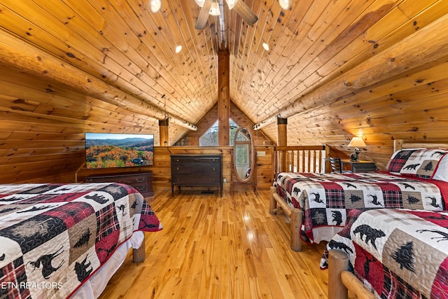 bedroom with wood-type flooring, wood ceiling, wood walls, and vaulted ceiling