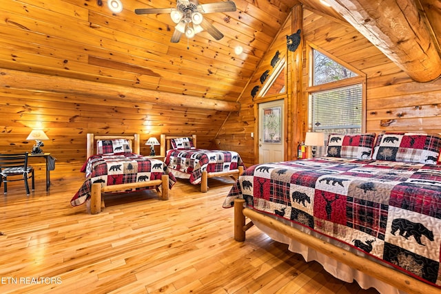 bedroom featuring vaulted ceiling, wooden walls, wooden ceiling, and wood-type flooring