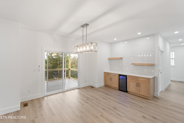 kitchen with visible vents, light wood finished floors, open shelves, recessed lighting, and wine cooler