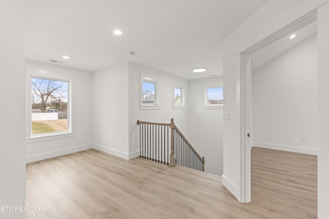 interior space featuring recessed lighting, visible vents, baseboards, and light wood-style floors