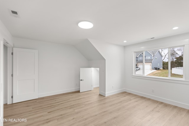 additional living space featuring recessed lighting, visible vents, baseboards, and light wood finished floors