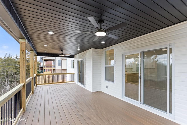 wooden terrace with a ceiling fan