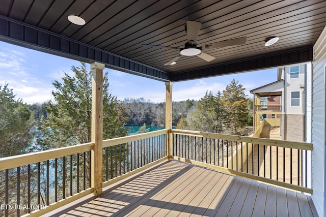 wooden deck featuring a ceiling fan