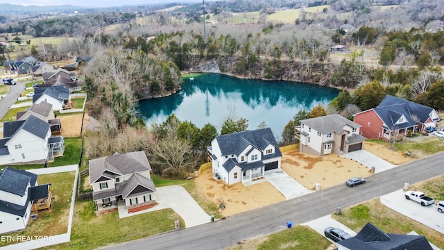 aerial view with a residential view and a water view