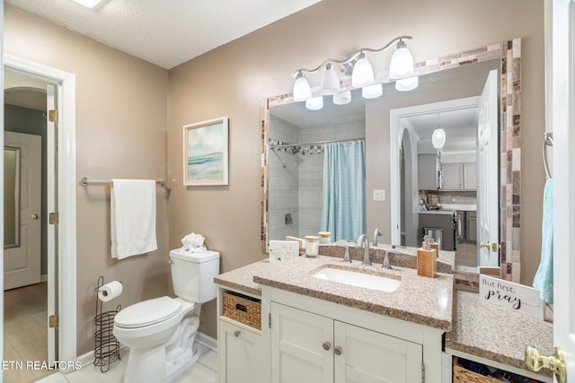 bathroom featuring toilet, a textured ceiling, a shower with shower curtain, tile patterned flooring, and vanity