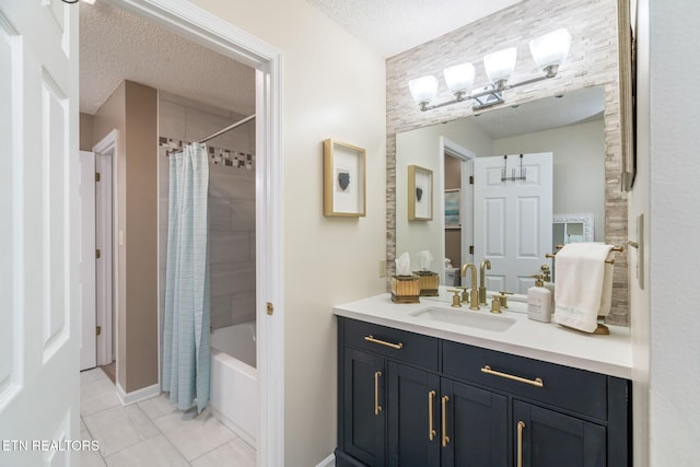 bathroom featuring vanity, tile patterned floors, shower / tub combo, and a textured ceiling