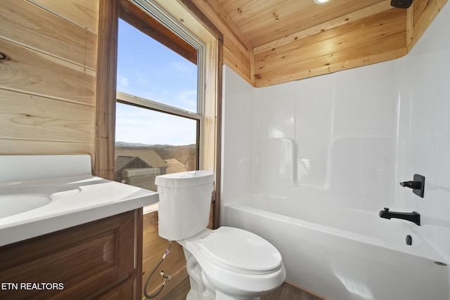 bathroom featuring toilet, wooden ceiling, bathtub / shower combination, and vanity