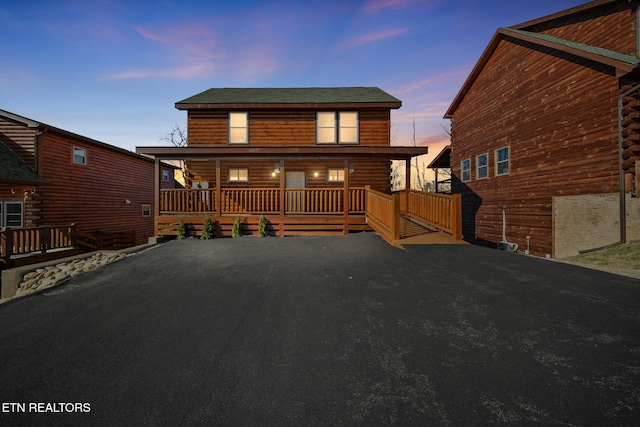 view of front of property featuring log siding