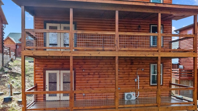 rear view of property featuring ac unit