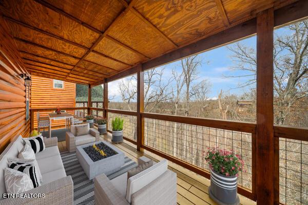 sunroom / solarium featuring wooden ceiling