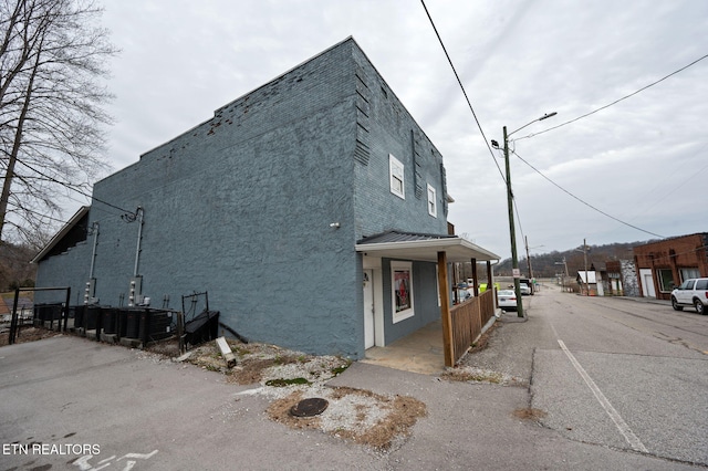 view of side of home with stucco siding