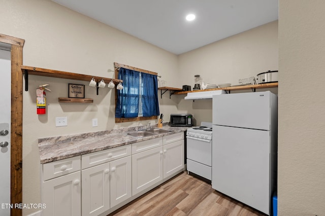 kitchen with white cabinetry, white appliances, open shelves, and a sink