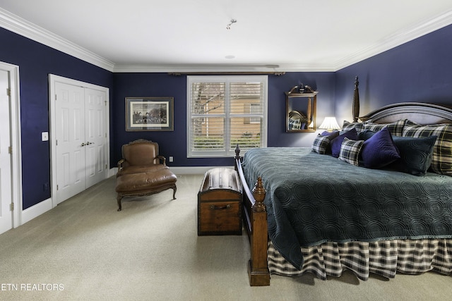 carpeted bedroom featuring baseboards and ornamental molding