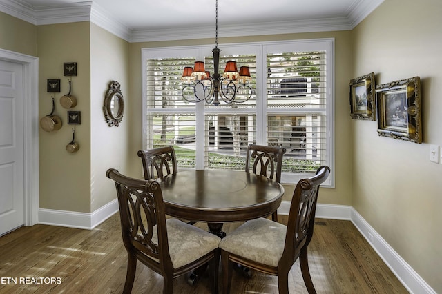 dining space featuring a wealth of natural light, a notable chandelier, and wood finished floors