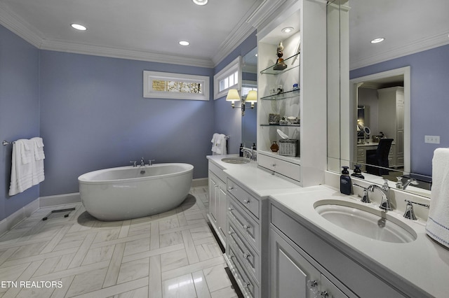 bathroom featuring vanity, a freestanding bath, and crown molding