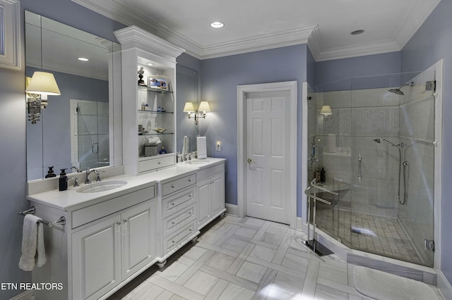 full bathroom featuring a sink, double vanity, ornamental molding, and a shower stall