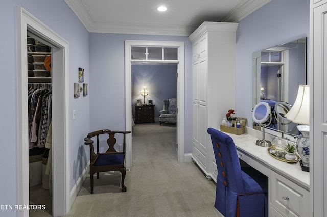 office with light carpet, built in desk, baseboards, and ornamental molding