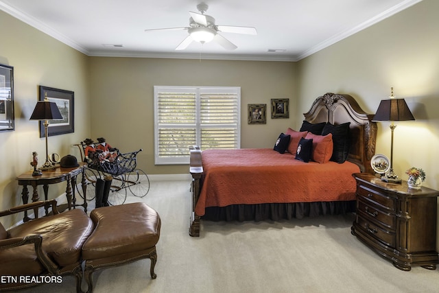 bedroom with visible vents, light colored carpet, ornamental molding, and a ceiling fan