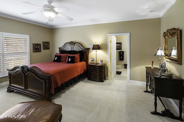 carpeted bedroom featuring ceiling fan, connected bathroom, crown molding, and baseboards