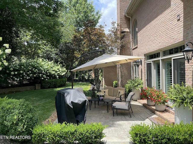 view of patio featuring an outdoor living space and a grill