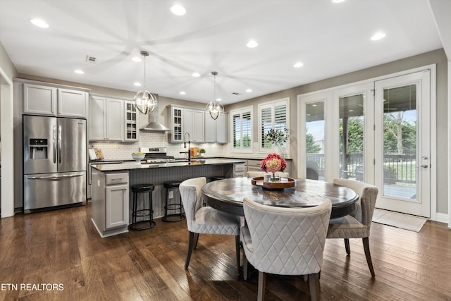 dining area with dark wood-style floors, visible vents, and recessed lighting