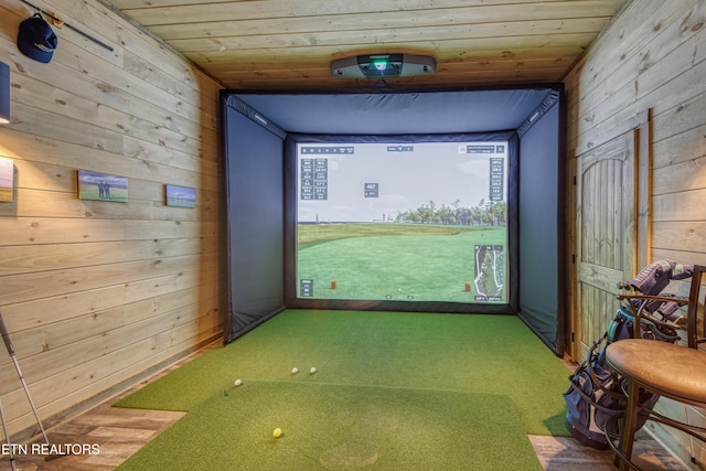 playroom featuring wooden ceiling, carpet, wooden walls, and golf simulator