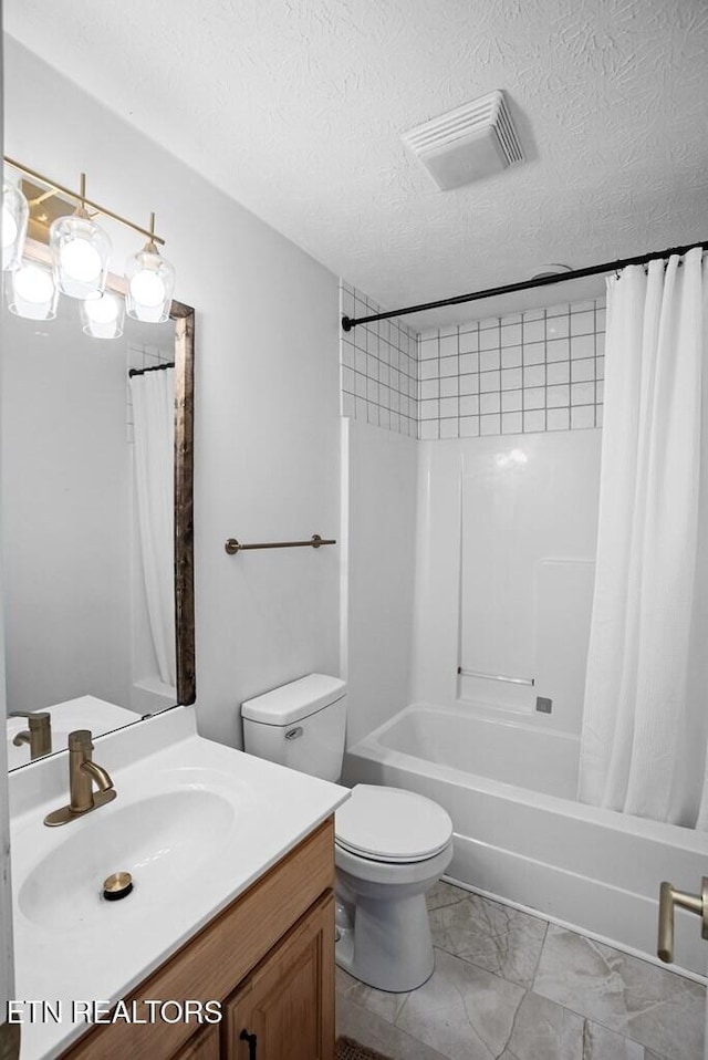 bathroom featuring visible vents, toilet, shower / tub combo, a textured ceiling, and vanity