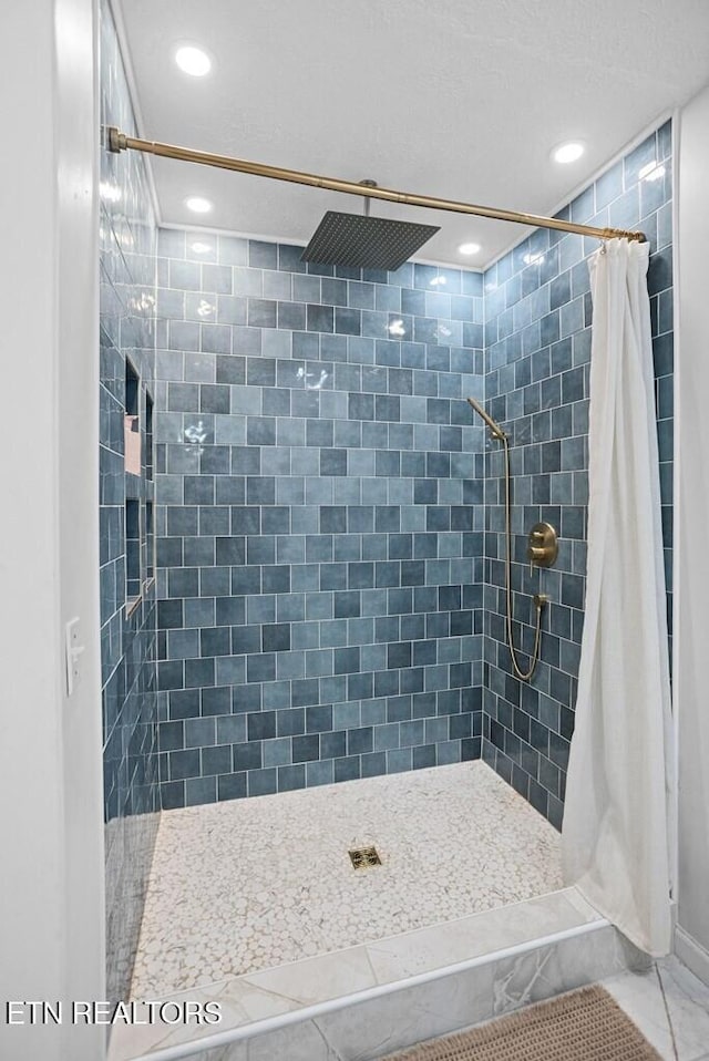 full bathroom featuring a shower stall and recessed lighting